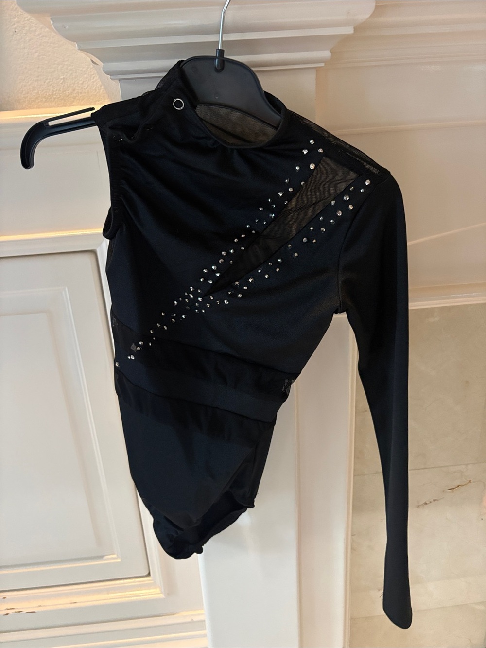 Black One-Shoulder Long Sleeve leotard with custom bedazzling. Medium child.